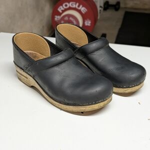 Dansko Black Leather Mules with Tan Sole